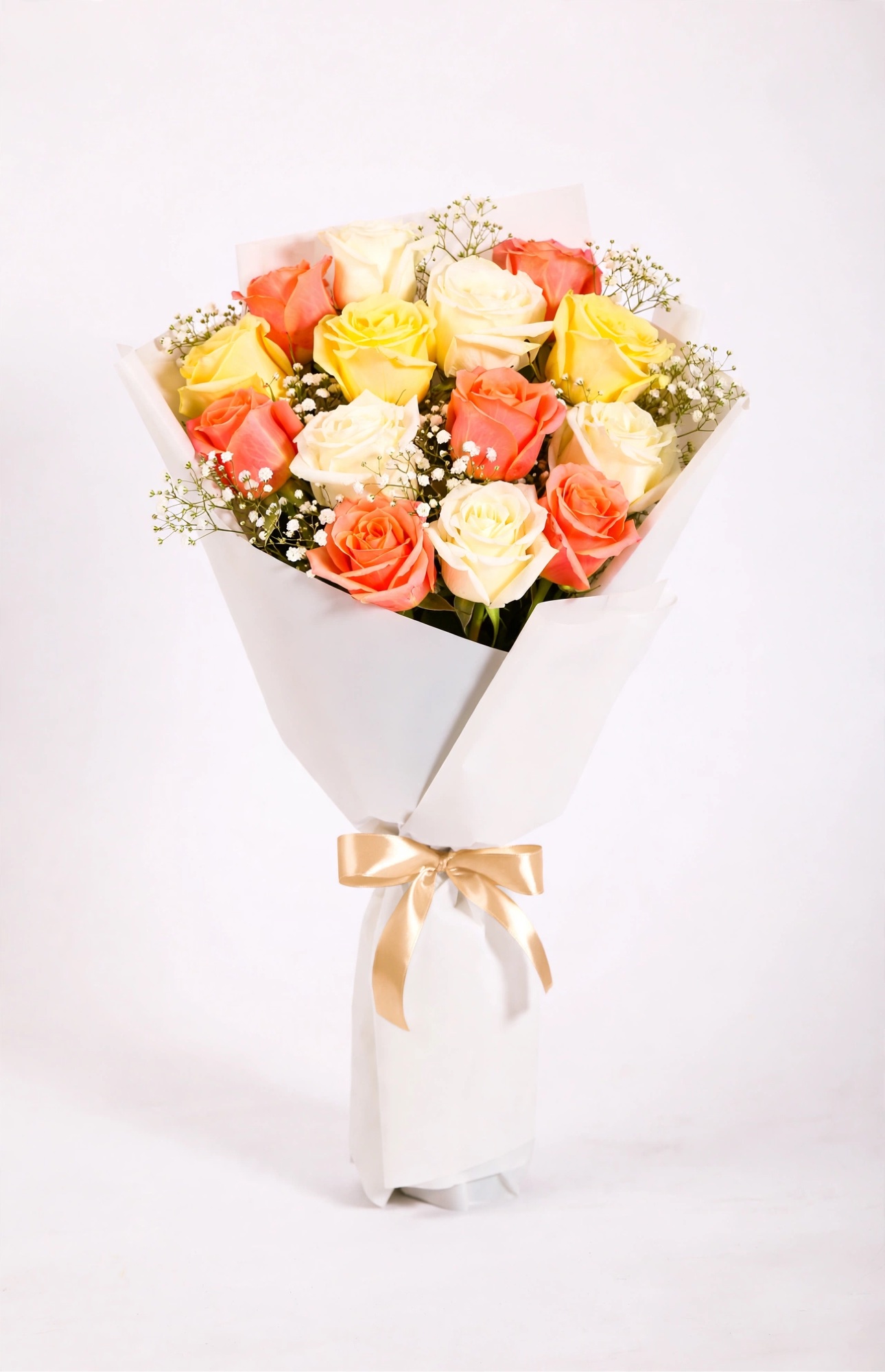 Sunrise Rose Bouquet — white, buttery yellow, and peach-orange roses with baby's breath in white wrap, tied with a champagne-gold satin bow
